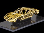 1:24 scale gold sculpture of a Lamborghini Miura crafted by Swiss artist Dante Rubli