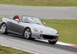 2009 Honda S2000 driving on a racetrack