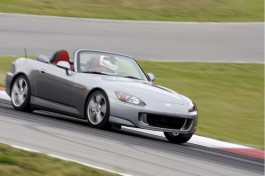 2009 Honda S2000 driving on a racetrack