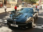 Prince Albert of Monaco and Henrik Fisker drive Fisker Karma on Monaco Grand Prix circuit, May 2011