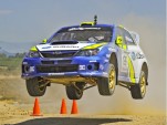 2011 Subaru Rally Team race car at speed