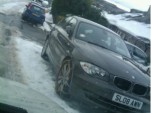 BMW 1-Series with snow chains on front wheels, Staffordshire, England, Dec 2010, photo by Andy Smith