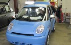 New Management, Structure, Cash For Electric-Car Maker Think?