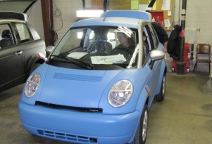New Management, Structure, Cash For Electric-Car Maker Think?