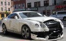 Wrecked 2013 Bentley Continental GT at the curb on a street in Manhattan