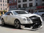 Wrecked 2013 Bentley Continental GT at the curb on a street in Manhattan