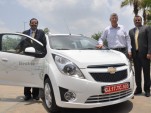Chevrolet Beat EV electric vehicle with GM executives, India, June 2011