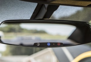 2013 Chevrolet Camaro's frameless rear-view mirror with electrochromic OnStar buttons