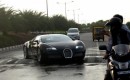 A Bugatti Veyron tackles a speed bump.