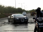 A Bugatti Veyron tackles a speed bump.
