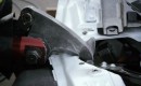 A hydraulic tool cuts apart the Tesla Model S