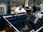 A UAW worker assembling a Hummer H3T