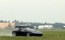 An F16 closes on a Lamborghini Aventador