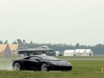 An F16 closes on a Lamborghini Aventador