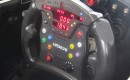An IndyCar steering wheel, showing the green push-to-pass button - image: IndyCar