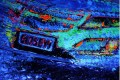 Artist Ian Cook's fluorescent Chevy Volt painting. Image: popbangcolour on flickr