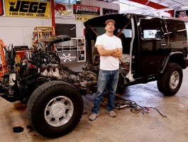 Artist Jeremy Dean with half a Hummer H2 for his work, "Back to the Futurama," January 2010