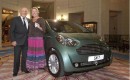 Sir Stirling Moss and his new Aston Martin Cygnet