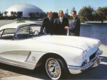 Astronaut Alan Shepard (center) with GM reps and his 1962 Corvette