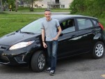 New-car owner John Knox with his 2011 Ford Fiesta SE hatchback, May 2011