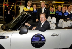 British Prime Minister David Cameron driving the two-millionth MINI produced. Image: MINI