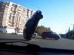 Car is flipped by downed power lines