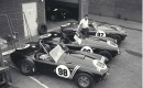Carroll Shelby with 3 Cobra roadsters in 1963
