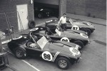 Carroll Shelby with 3 Cobra roadsters in 1963
