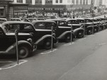 Cars parked diagonally along parking meters, Omaha, Nebraska, 1938 (via Wikimedia)