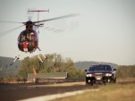 Dodge Challenger SRT8 versus an MD 500-D helicopter