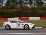 Dr. Ulrich Bez's Vantage GT4, showing Aston Martin's centenary logo