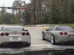 Drivers of C6 and C5 Chevrolet Corvettes participate in public road drag race