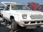 Electrica 007 in junkyard, by Mike Bumbeck, Clunkbucket