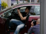 Elon Musk signs new 2013 Tesla Model S at Tesla Store opening, Austin, Texas [photo: John Griswell]