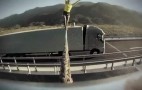 Woman Walks Rope Between Two Moving Volvo Semi Trucks: Video