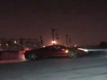 Ferrari 458 Italia doing donuts atop ancient Chinese wall