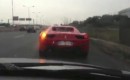 Ferrari 458 Italia that's about to crash into a highway barrier