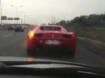 Ferrari 458 Italia that's about to crash into a highway barrier