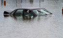 Flooded car in parking lot. Photo via Flickr user waitscm/CC2.0