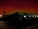 Four generations of the Porsche 911 Carrera 4 line up for a photo op