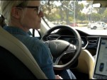 GigaOm's Katie Fehrenbacher behind the wheel of a 2012 Tesla Model S (video screen capture)