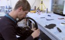 Hand-stitching the leather panels on the Agera R's steering wheel