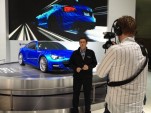 High Gear Media Team Shooting Video At 2011 Los Angeles Auto Show