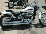 Honda Shadow motorcycle, brand-new, with straight pipes, by Flickr user Jess_Anderson