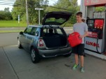 Filling up the Mini E at the gas station; photo, Michael Thwaite