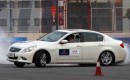 Sebastian Vettel at a track with the Infiniti G37 and FX50 