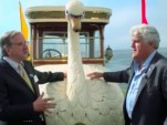 Jay Leno with the 1910 Brooke Swan Car at the 2012 Pebble Beach Concours d'Elegance