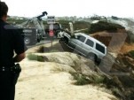Junior Seau's Cadillac Escalade being hauled back up the cliff -- via TMZ