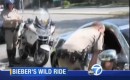 Justin Bieber talking to police in his chrome Fisker Karma - Image courtesy KABC-TV