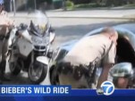 Justin Bieber talking to police in his chrome Fisker Karma - Image courtesy KABC-TV